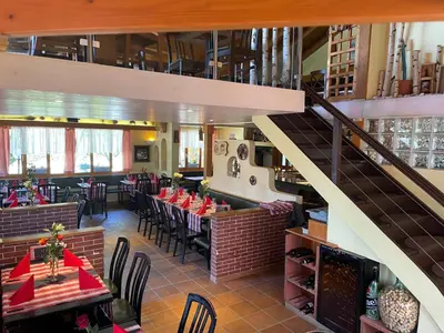 Ein Restaurant oder anderes Speiselokal in der Unterkunft Zimmer Mamma Mia