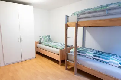 Ein Bett oder Betten in einem Zimmer der Unterkunft Blumenstrasse 22