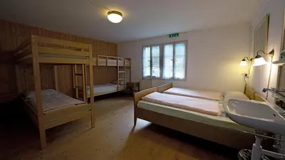 Ein Bett oder Betten in einem Zimmer der Unterkunft Leissigen Youth Hostel