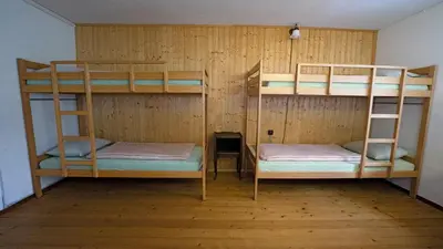 Ein Bett oder Betten in einem Zimmer der Unterkunft Leissigen Youth Hostel