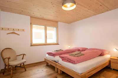 Ein Bett oder Betten in einem Zimmer der Unterkunft Ferienchalet Sonne