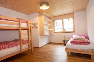 Ein Bett oder Betten in einem Zimmer der Unterkunft Ferienchalet Sonne