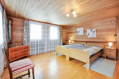 Ein Bett oder Betten in einem Zimmer der Unterkunft Haus Weissmies