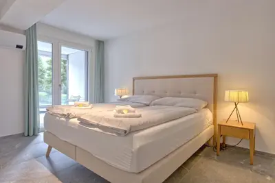 Ein Bett oder Betten in einem Zimmer der Unterkunft Apartment JungfrauCenter Schynige Platte - GRIWA RENT AG