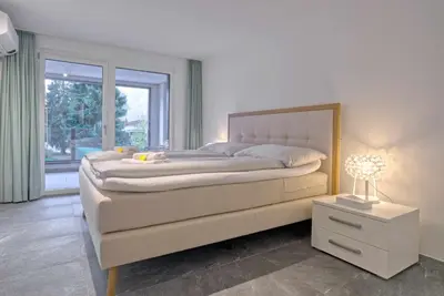 Ein Bett oder Betten in einem Zimmer der Unterkunft Apartment JungfrauCenter Bällenhöchst - GRIWA RENT AG