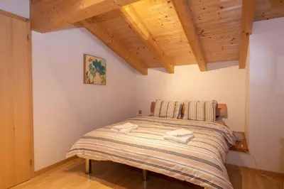 Ein Bett oder Betten in einem Zimmer der Unterkunft Ferienwohnung Schützenrain DG