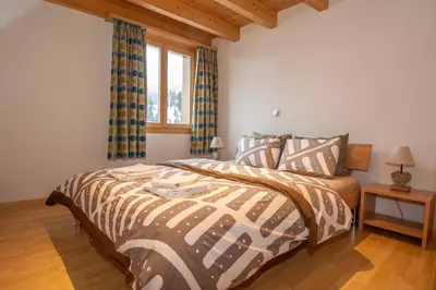 Ein Bett oder Betten in einem Zimmer der Unterkunft Ferienwohnung Schützenrain DG