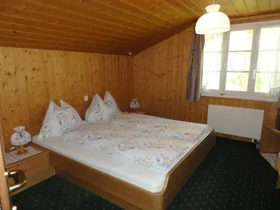 Ein Bett oder Betten in einem Zimmer der Unterkunft Hotel Blümlisalp