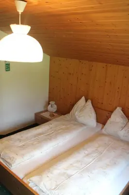 Ein Bett oder Betten in einem Zimmer der Unterkunft Hotel Blümlisalp
