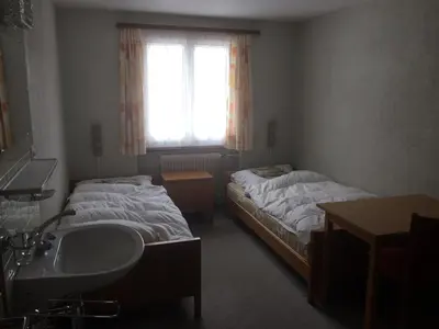 Ein Bett oder Betten in einem Zimmer der Unterkunft B&B Haus Granit Saas Grund