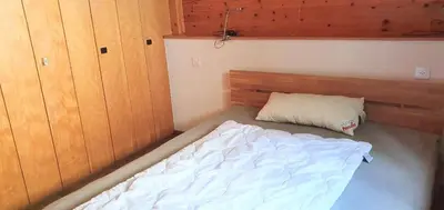 Ein Bett oder Betten in einem Zimmer der Unterkunft Wallisblick