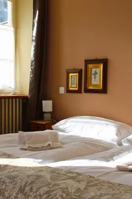 Ein Bett oder Betten in einem Zimmer der Unterkunft Hôtel Le Besso - Swiss Romantic Lodge Zinal