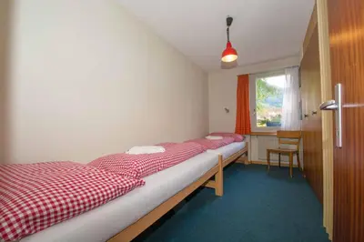 Ein Bett oder Betten in einem Zimmer der Unterkunft Ferienwohnung Kurhaus