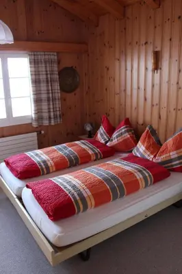 Ein Bett oder Betten in einem Zimmer der Unterkunft Chalet Spinne