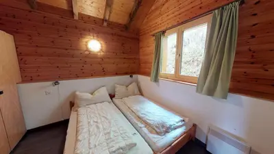 Ein Bett oder Betten in einem Zimmer der Unterkunft Tschuggen 58