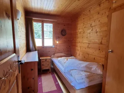 Ein Bett oder Betten in einem Zimmer der Unterkunft Zer Tanna