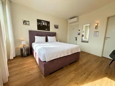 Ein Bett oder Betten in einem Zimmer der Unterkunft Hotel Movieworld