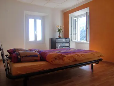 Ein Bett oder Betten in einem Zimmer der Unterkunft Appartamento via Luina