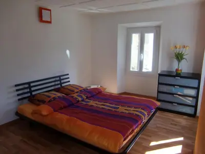 Ein Bett oder Betten in einem Zimmer der Unterkunft Appartamento via Luina