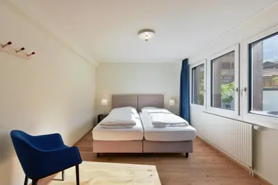 Ein Bett oder Betten in einem Zimmer der Unterkunft Ferienlenk Mountain Village