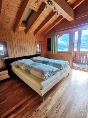 Ein Bett oder Betten in einem Zimmer der Unterkunft Chalet Edi