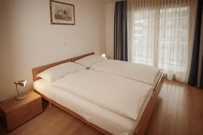 Ein Bett oder Betten in einem Zimmer der Unterkunft Haus Mischabel