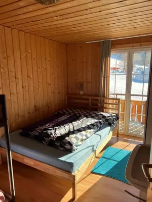 Ein Bett oder Betten in einem Zimmer der Unterkunft Berghotel Furggstalden