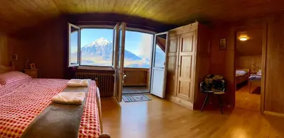 Ein Bett oder Betten in einem Zimmer der Unterkunft CHALET EGGLEN 