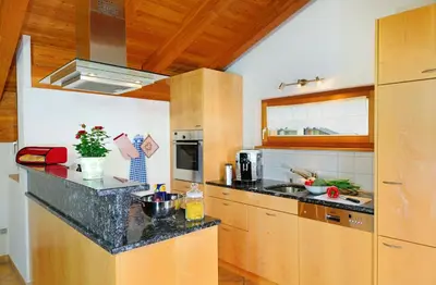 Küche/Küchenzeile in der Unterkunft Chalet Z`Wichjehüs