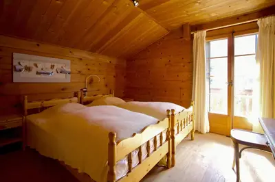 Ein Bett oder Betten in einem Zimmer der Unterkunft Magnifique chalet familial pour 10 personnes au coeur de Nax