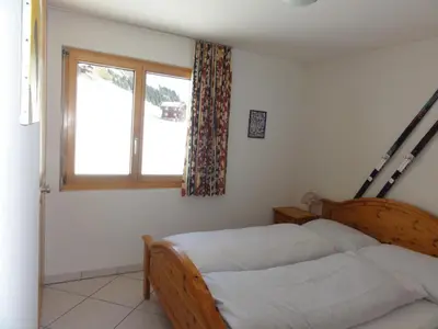 Ein Bett oder Betten in einem Zimmer der Unterkunft Apartment Weisshorn
