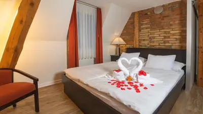 Ein Bett oder Betten in einem Zimmer der Unterkunft Swiss Inn & Apartments
