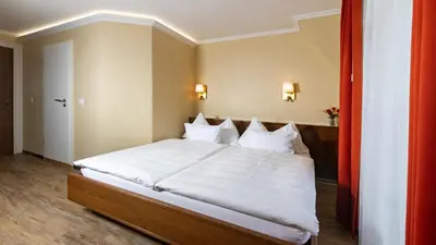 Ein Bett oder Betten in einem Zimmer der Unterkunft Swiss Inn & Apartments