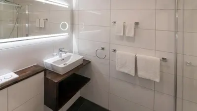 Ein Badezimmer in der Unterkunft Swiss Inn & Apartments