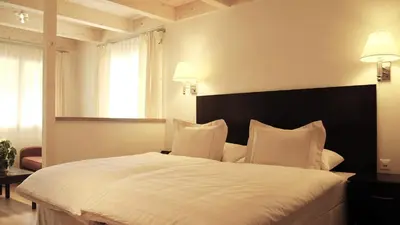 Ein Bett oder Betten in einem Zimmer der Unterkunft Swiss Inn & Apartments