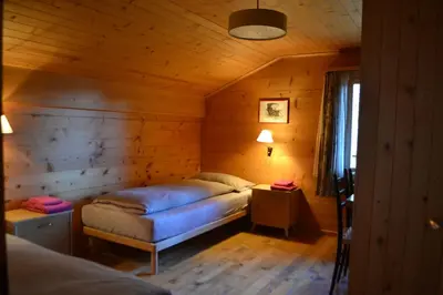 Ein Bett oder Betten in einem Zimmer der Unterkunft Chalet Minga Mal