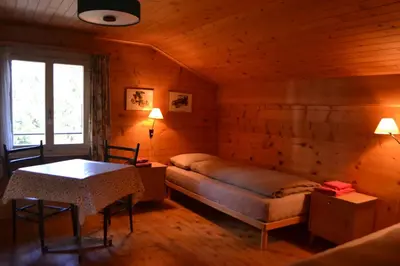 Ein Bett oder Betten in einem Zimmer der Unterkunft Chalet Minga Mal