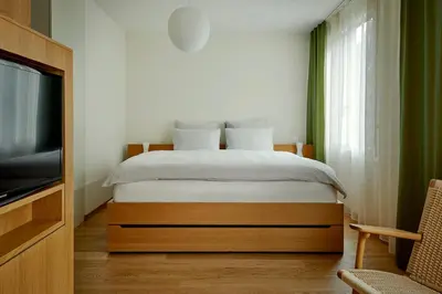 Ein Bett oder Betten in einem Zimmer der Unterkunft Bellevue Parkhotel & Spa - Relais & Châteaux