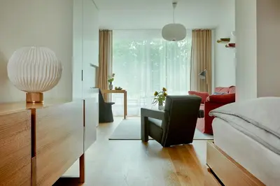 Ein Bett oder Betten in einem Zimmer der Unterkunft Bellevue Parkhotel & Spa - Relais & Châteaux
