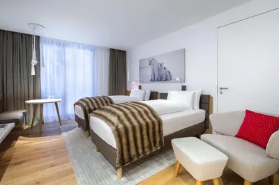Ein Bett oder Betten in einem Zimmer der Unterkunft Radisson Blu Hotel Reussen, Andermatt