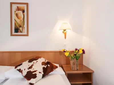 Ein Bett oder Betten in einem Zimmer der Unterkunft Hotel Oberland