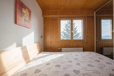 Ein Bett oder Betten in einem Zimmer der Unterkunft Immeuble Horizon