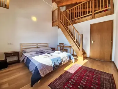 Ein Bett oder Betten in einem Zimmer der Unterkunft Chalet Chalet Aglaia by Interhome