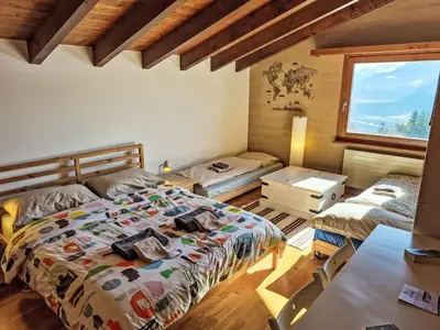 Ein Bett oder Betten in einem Zimmer der Unterkunft Chalet Chalet Aglaia by Interhome
