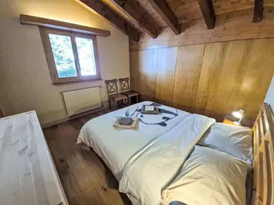 Ein Bett oder Betten in einem Zimmer der Unterkunft Chalet Chalet Aglaia by Interhome