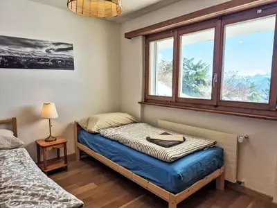 Ein Bett oder Betten in einem Zimmer der Unterkunft Chalet Chalet Aglaia by Interhome