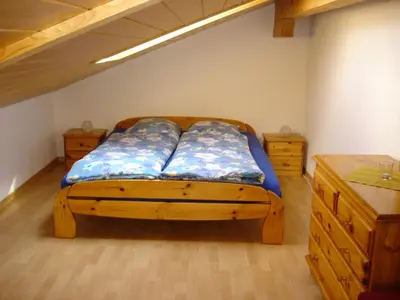 Ein Bett oder Betten in einem Zimmer der Unterkunft Chalet Sunneschyn