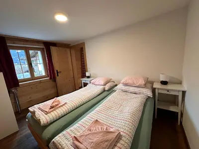Ein Bett oder Betten in einem Zimmer der Unterkunft One Bedroom with mountain and garden view ground floor of Chalet Solaria