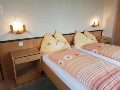 Ein Bett oder Betten in einem Zimmer der Unterkunft Hotel Simplon-Blick