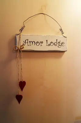 Ein Zertifikat, Auszeichnung, Logo oder anderes Dokument, das in der Unterkunft Amor Lodge ausgestellt ist